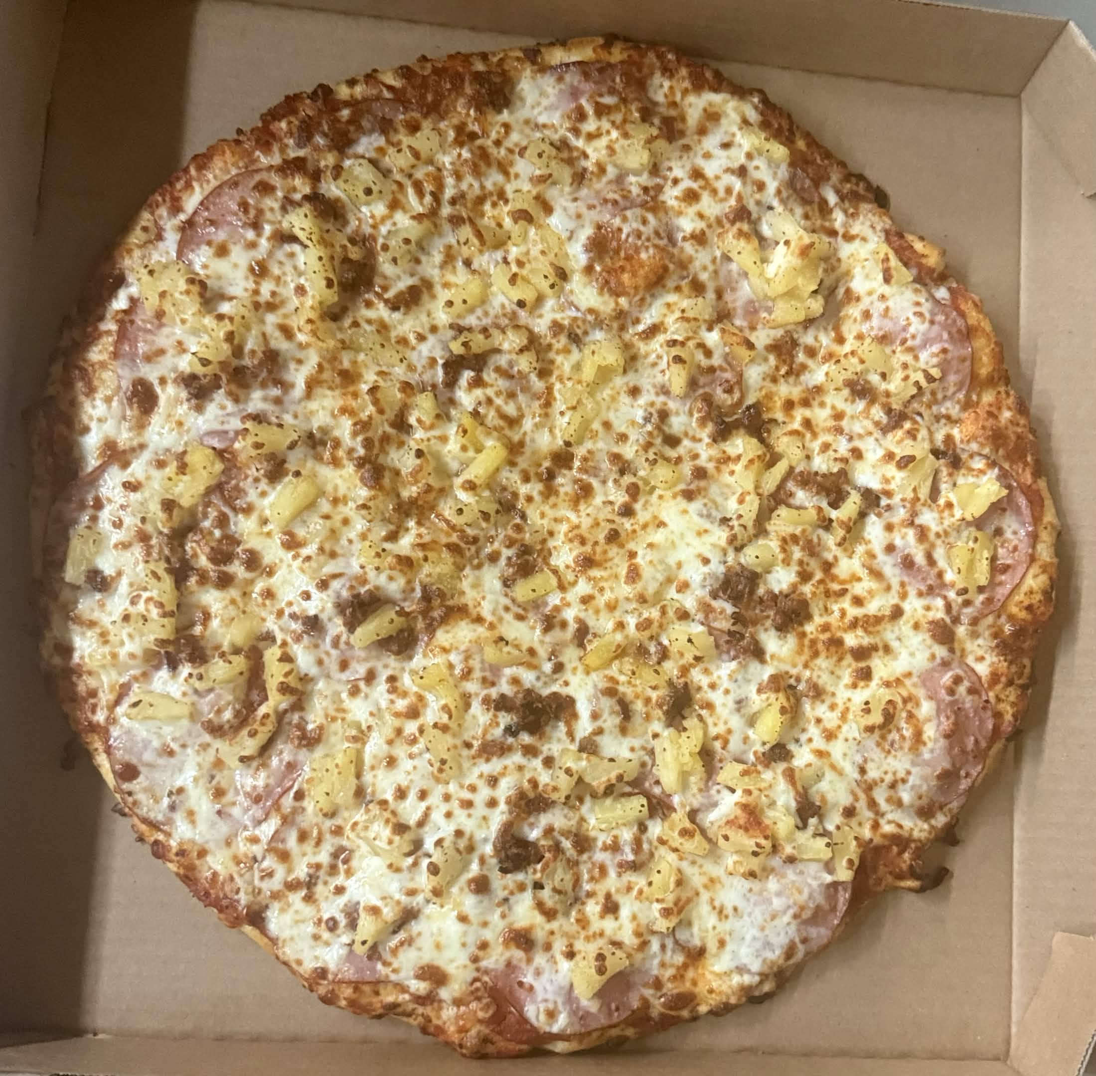 Friends sharing artisan pizza at Vashon Pizza on Vashon Island